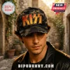 KISS Band Golden Logo Camo Baseball Cap worn by a man, featuring a black and grey camouflage print with gold text.