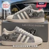 Las Vegas Raiders Denim Canvas Casual Shoes featuring grey fabric, team logos, stadium graphics, and cream-colored accents.