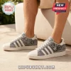 Las Vegas Raiders Denim Canvas Casual Shoes featuring grey wash fabric, team mascot graphics, and white rubber outsoles.