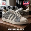 Las Vegas Raiders Denim Canvas Casual Shoes featuring team logos, grey denim texture, white stripes, and lace-up closure.