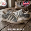 Las Vegas Raiders Denim Canvas Casual Shoes featuring team logo, skyline graphics, and beige soles on a wooden background.