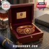 Lion Strength Horoscope Engraved Bracelet in gold with lion head detail resting inside a lined dark wood jewelry box.
