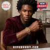 Lion Strength Horoscope Engraved Bracelet in antique gold tone worn by a man in a burgundy velvet blazer.