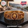 Lion Strength Horoscope Engraved Bracelet in gold with lion head, zodiac symbols, and maroon accents on a black base.