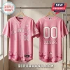 Los Angeles Dodgers x Breast Health Awareness pink baseball jersey showing front and back with star patterns on hangers.