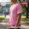 Los Angeles Dodgers x Breast Health Awareness pink baseball jersey featuring white lettering and a pink ribbon icon.