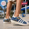Los Angeles Rams Adidas Campus Casual Shoes featuring blue side panels, mascot graphics, and white leather accents.