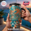 Miami Dolphins 60th Anniversary YETI Tumbler featuring tie-dye orange and teal graphics, a team logo, and stadium imagery.