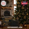Michigan Wolverines Go Blue 24-Day Christmas Advent Calendar box next to a tree decorated with maize and blue ornaments.
