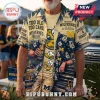 Michigan Wolverines NCAA Mascot Hawaiian Shirt featuring yellow mascot heads, navy palm trees, and team text on tan fabric.