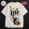 Miller Lite Halloween Skeleton T-Shirt 2026 features a graphic of a beer can, crescent moon, bat, and pumpkins on cream.