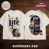 Miller Lite Halloween Skeleton T-Shirt 2026 featuring a beer can, jack-o'-lanterns, and skeleton hand on white fabric.