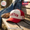 Minnesota Twins Byron Buxton embroidered hat featuring red and cream panels on a wooden bench with baseball gloves.