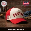 Minnesota Twins Byron Buxton Embroidered Hat with a cream crown, red bill, and red lettering on a wooden desk surface.