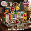 M&M's Candy Store Building Block Set featuring red and yellow M&M figures, colorful brick walls, and interior candy bins.