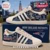 New England Patriots Adidas casual sneakers featuring blue denim patterns, team logos, and the Patriots mascot graphic.