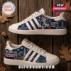 New England Patriots Adidas Casual Sneakers featuring blue team graphics, a mascot illustration, and white three-stripe design.