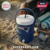 New England Patriots Plastic Souvenir Cooler Cup with blue body, white lid, and team logo on the side on a beach tailgate.