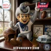 NFL Dallas Cowboys mascot soft plush toy wearing a cowboy hat and uniform with the team star logo on a desk.