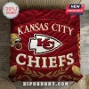 NFL Kansas City Chiefs Quilted 3-Piece Bedding Set featuring a large red logo, team helmet, and footballs on a quilted base.