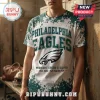 NFL Philadelphia Eagles bleach wash T-shirt featuring green splatter patterns and team graphics on a white background.