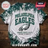 NFL Philadelphia Eagles Bleach Wash T-Shirt featuring midnight green and silver graphics on a distressed white fabric base.