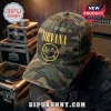 Nirvana Nevermind Smiley Camouflage Baseball Cap with yellow embroidered logo on a green and brown woodland print background.