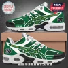 Notre Dame Fighting Irish Green Air Max Plus Sneakers featuring white and green mesh with gold accents and team logos.