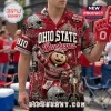 Ohio State Buckeyes Mascot Brutus Hawaiian shirt featuring Brutus, team logos, football helmets, and red pattern graphics.