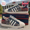 Ole Miss Rebels Adidas Casual Sneakers featuring a mascot, football field graphics, and red, navy, and white color scheme.