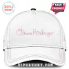Olivia Rodrigo The Unraveled Tour 2026 pink hoodie merchandise baseball cap in white with pink script logo and stitching.