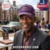 Omega Psi Phi 115th Anniversary Purple Distressed Baseball Cap with gold embroidery on a man sitting outdoors.