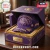 Omega Psi Phi 115th Anniversary Purple Distressed Baseball Cap inside a matching branded purple display box with gold text.