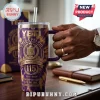 Omega Psi Phi 115th Anniversary YETI Tumbler 40oz featuring purple and gold tie-dye design with fraternity crest and logos.