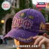 Omega Psi Phi Distressed Purple Baseball Cap with embroidered Greek letters, 1911 patch, and bulldog logo on side panel.