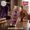 Omega Psi Phi Embossed Purple Gold Stanley Tumbler 40oz featuring intricate filigree, Greek letters, and a central jewel.