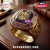 Omega Psi Phi Fraternity Premium Amethyst Ring featuring a gold band, purple gemstone, and 1911 engraving on leather desk.
