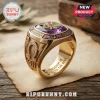 Omega Psi Phi Fraternity Premium Amethyst Ring in gold with a central purple gemstone and engraved Greek symbols.