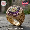 Omega Psi Phi Fraternity Premium Amethyst Ring in gold with a purple center stone, crest, and etched inner band text.