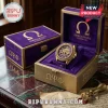 Omega Psi Phi Gold Tone Purple Watch set inside a matching velvet-lined display box with Greek lettering and logos.