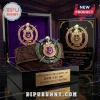Omega Psi Phi Limited Edition Leather Belt featuring an embossed brown strap and a metal crest buckle in a display box.