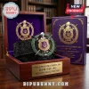 Omega Psi Phi Limited Edition Leather Belt with metallic crest buckle in a purple velvet-lined wooden collector box.