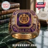 Omega Psi Phi Purple Amethyst Gold Ring featuring the fraternity crest, gold engraving, and side stones on marble surface.