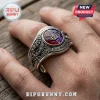 Ozzy Osbourne 1970-2026 Engraved Ring featuring a silver band with bat motifs and a circular purple and red gemstone center.
