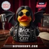 Ozzy Osbourne Bat Wings Rubber Duck Statue with black wings, round sunglasses, studded jacket, and cross necklace on wood base.