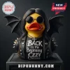 Ozzy Osbourne Bat Wings Rubber Duck Statue wearing a leather jacket, round sunglasses, and a cross necklace on dark background.