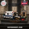 Paramedic Tribute Emergency Ambulance Building Set featuring two medic figurines, a stretcher, and a display base.