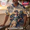 Parramatta Eels NRL Mascot Hawaiian shirt featuring beach scenery, team logos, and text on a tan and blue fabric print.