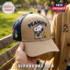 Peanuts Autism Awareness Snoopy Beige Baseball Cap featuring embroidered Snoopy, Woodstock, and colorful puzzle pieces.