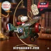 Peanuts Snoopy Flying Ace Christmas Tree Ornament featuring Snoopy in an aviator cap on a vintage green biplane.